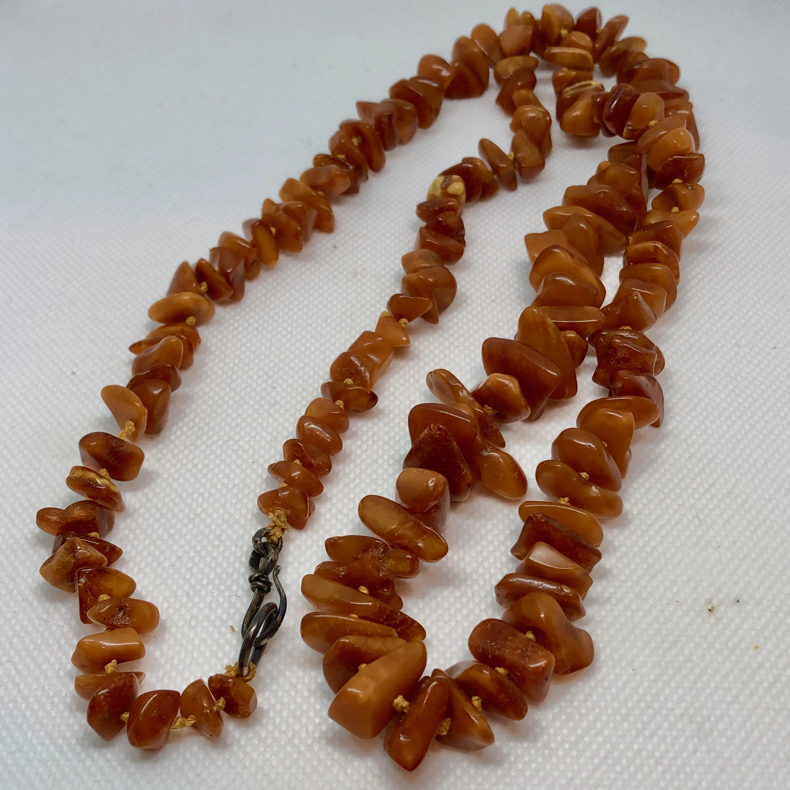 Butterscotch amber necklace, thirty-nine graduated oval beads, the smallest  bead measuring approx 6m