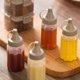 thumbnail image 2 of 12 botellas portátiles para condimentos de cocina, a prueba de fugas y reutilizables, dispensadores de salsa para aderezos para ensaladas, kétchup, mostaza y jarabe, 2 of 7