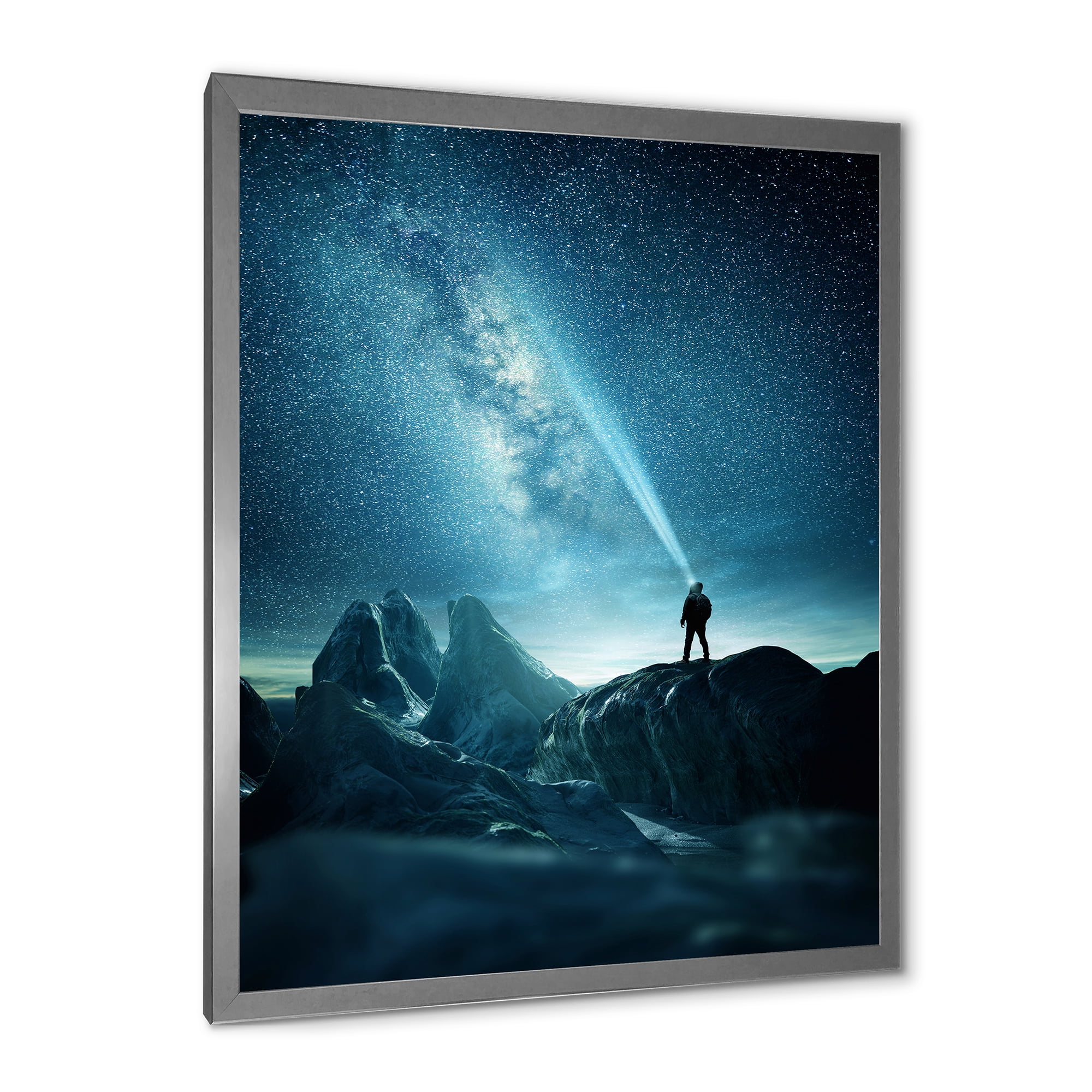 Designart 'A Light Shining by A Man Shining Into The Night Sky' Modern Framed Art Print