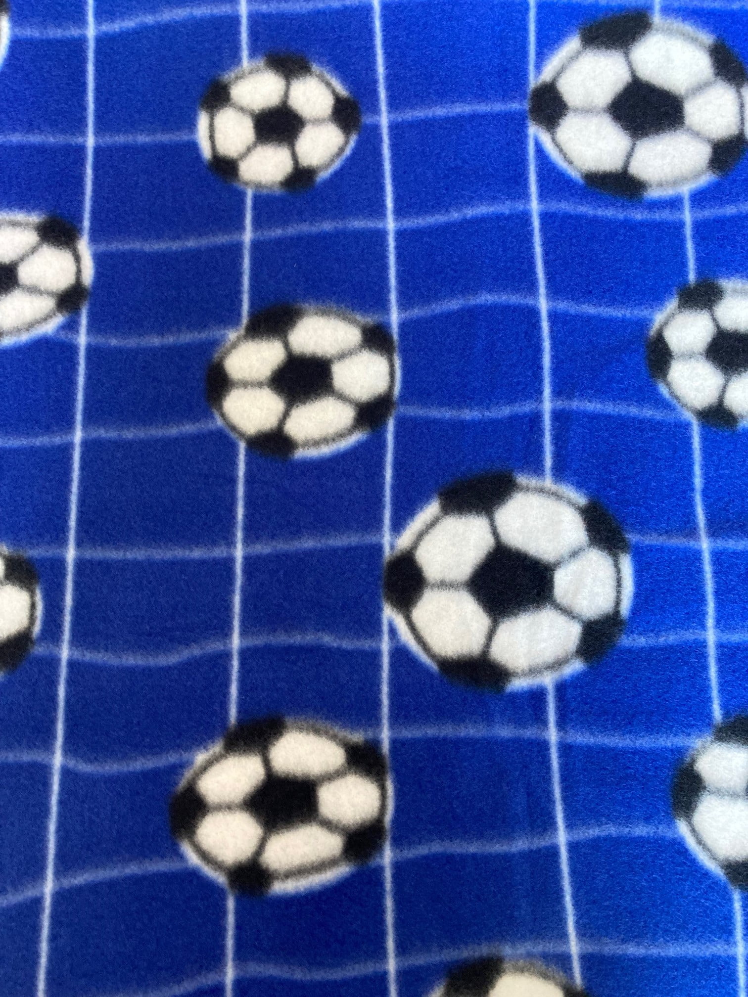 Lilly Craft Soccer Balls and Net on Royal Blue Fleece Fabric Lilly Craft Soccer Balls and Net on Royal Blue Fleece Fabric