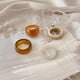 thumbnail image 1 of Conjunto De Anillos De Resina De Colores Ajustable Chica 4 piezas marrón beige. Hugo Anillos abiertos, 1 of 7