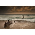 thumbnail image 2 of Wooden posts on a beach with a boat being tossed in the water and waves crashing into the sand under a cloudy sky; Queen, 2 of 4