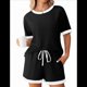 thumbnail image 1 of Traje de Corta con Bloques de Color, Negro, Talla L, 1 of 7