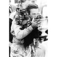 thumbnail image 2 of Peter Revson Drinks From His Trophy After Winning The Canadian-American Championship. Watkins Glenn History, 2 of 2