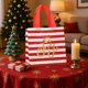 thumbnail image 4 of Bolsa de Regalo Navideña de Tela No Tejida | Estampado Festivo de Papá Noel, Copos de Nieve, Alce y Árbol de Navidad | 20 X 20 X 9 Cm | Roja | Bolsa de Almacenamiento Reutilizable E Impermeable, 4 of 6