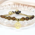 thumbnail image 4 of AeraVida Mystical Aum or Om Brown Tiger's Eye and Brass Beads Jingle Bell Bracelet for Female Anniversary, 4 of 6