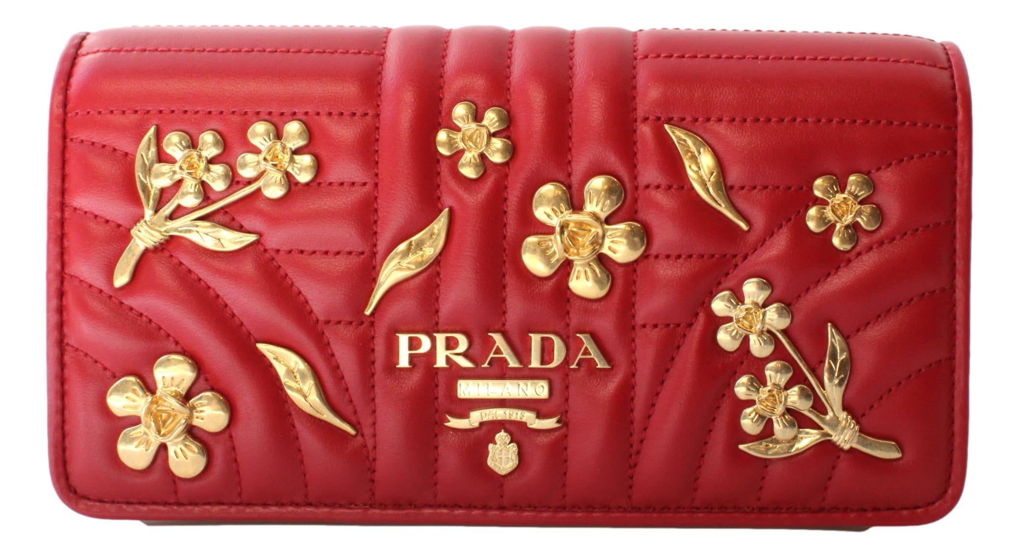 Prada wallet on gold chain. Patterned maxi skirt. Red nails