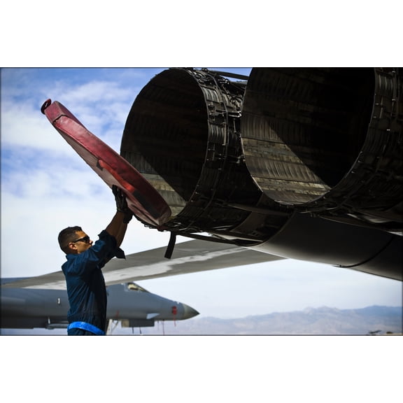 24"x36" Gallery Poster, crew chief removes exhaust covers from a B-1B Lancer bomber