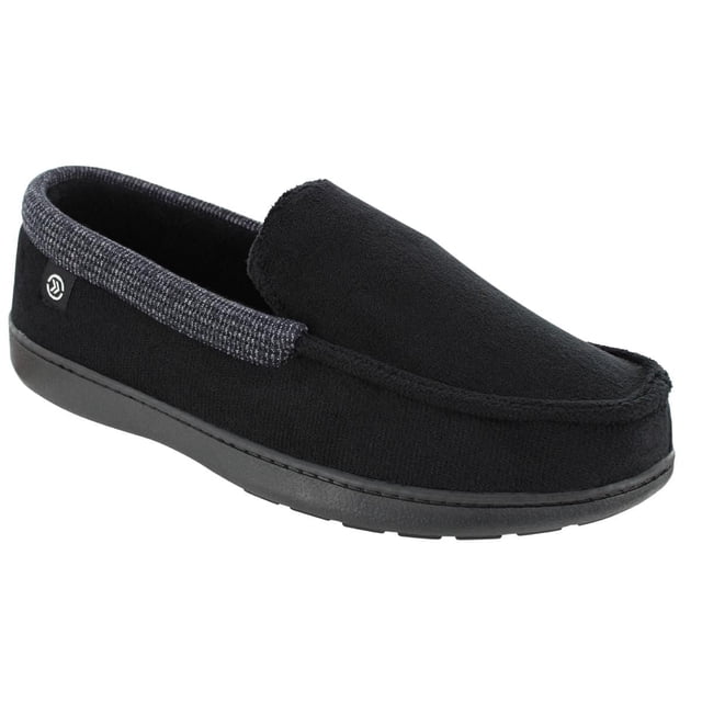 Isotoner Men's Closed Back Slipper in black microterry with a contrasting waffle-knit heel strip, memory foam cushioning, and rubber outsole, shown in a 3/4 profile on white background, suitable for indoor casual wear and comfort.