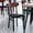 Walnut Wood Back/Black Vinyl Seat, variant on Emma + Oliver Set of Two Industrial Dining Chairs with Black Steel Frame, Gray Padded Vinyl Seat and Walnut Finished Wood Backrest