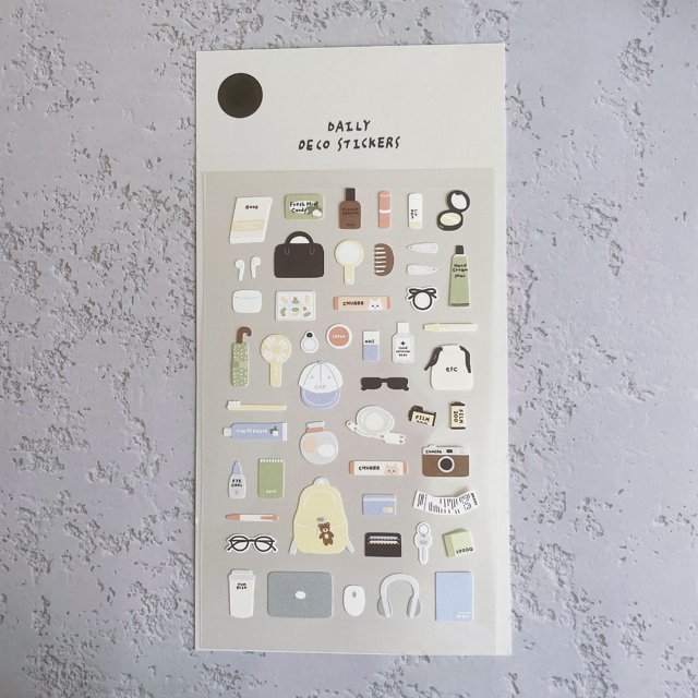 1pc daily deco sticker, the things in my bag nylon stickers for scrapbooking diy journal stationery sticker deco art supply — front-facing sheet of nylon stickers on white backing labeled 'DAILY DECO STICKERS' showing illustrated bag items: purse, backpack, sunglasses, headphones, camera, phone, wallet, keys, lip balm, compact mirror, notebook and travel mug arranged in rows.