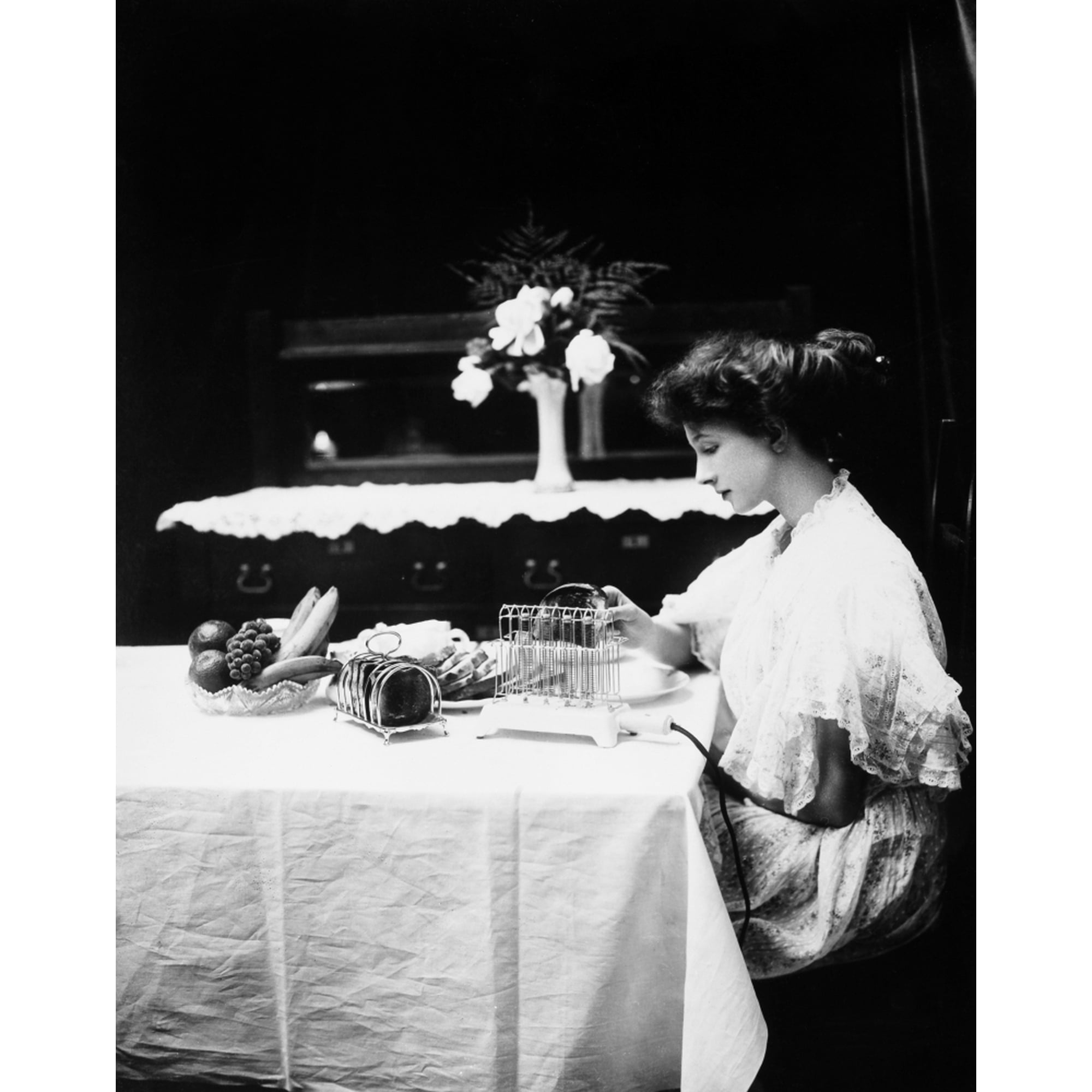 Posterazzi Electric Toaster 1908. Na Woman Removing A Slice Of Toast From An Electric Toaster Manufactured By General Electric. Photographed In 190