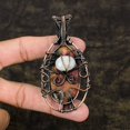 thumbnail image 2 of Natural Rhodonite, Moonstone Gemstone Copper Wire Wrap Pendant 3.39", 2 of 5