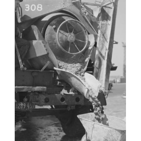 Concrete mixer pouring wet concrete into wheel barrow Canvas Art - (24 x 36)