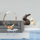 thumbnail image 2 of Elegante organizador de metal con estatuas de cerámica, expositor de botellas único y decoración de conejo para armario y jardín., 2 of 8