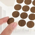 thumbnail image 4 of Uxcell 270 Piezas Etiquetas para Agujeros de Tornillo, 5 Hojas Autoadhesivas Impermeables para Reparación de Muebles, Nogal Claro, 21mm, 4 of 6