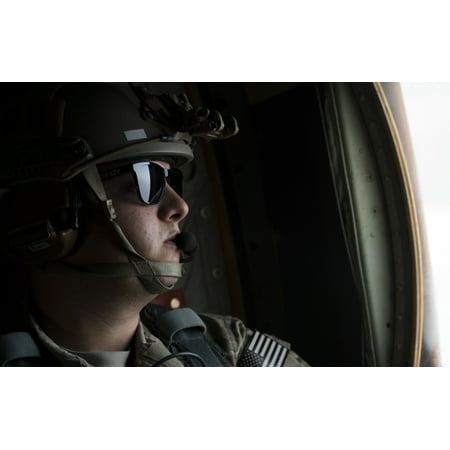 - US Air Force loadmaster looks out the window of a MC-130J Combat Shadow II Canvas Art - Stocktrek Images (35 x 23)