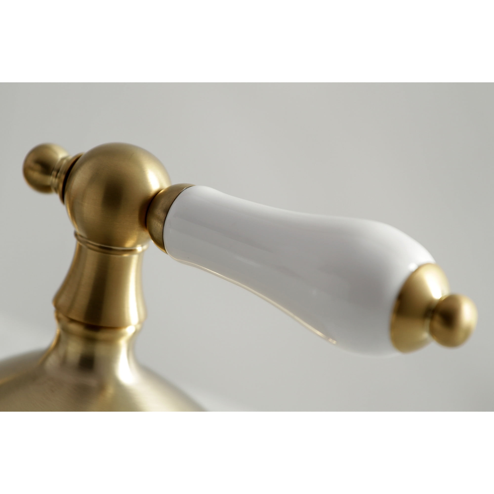 Kingston Brass KS1167PL Heritage Two-Handle 3-Hole Deck Mount Widespread Bathroom Faucet with Brass Pop-Up in Brushed Brass