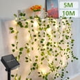 thumbnail image 1 of 7m/12m LED Solar Fairy String Lights Outdoor IP65 Waterproof Watermelon Leaves String Lights with 8 Lighting Modes and Memory Function for Garden Party Weddings Decoration, 1 of 11