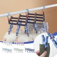 thumbnail image 1 of Xihbxyly Percha Plegable con 19 Pinzas, Diseño Compacto, Giratoria 360° y Resistente Al Viento, Multiusos para Toallas, Sujetadores, Ropa de Bebé, Lavandería o Uso Exterior, Compacta y Plegable, Tama, 1 of 2