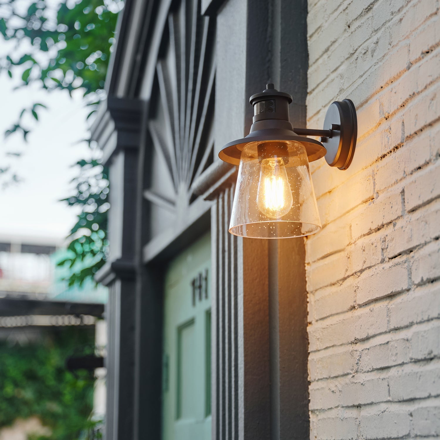 Globe Electric Juno 1-Light Matte Black Motion Sensor Outdoor Wall Sconce with Clear Seeded Glass Shade