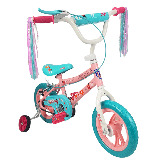 bicicleta infantil niñas r12 ruedas auxiliares goma unibike - ohlala, vista 3/4 frontal de bicicleta rosa y turquesa con manubrio blanco y borlas; asiento de goma sintética ajustable 43–50 cm, llantas EVA sin aire para rodada silenciosa, freno trasero, protector de cadena, pedales rosas y ruedas de entrenamiento instaladas; diseñada para aprender equilibrio en interiores o exteriores y a menudo usada para practicar coordinación motora en espacios reducidos.