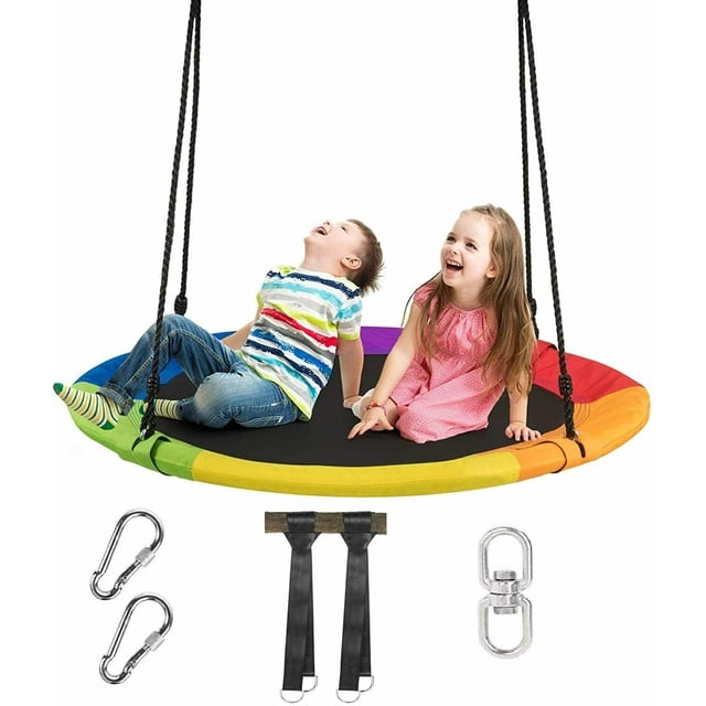 Gymax 40'' 770 lbs Flying Saucer Tree Swing for kids, featuring a colorful round design with a 40-inch diameter. The swing is shown with two children seated on it, supported by durable black ropes. Includes two tree hanging straps, carabiners, and a swivel for secure installation. Made from 900D Oxford fabric, PP material, and a steel frame, it supports up to 770 lbs and offers adjustable height from 47'' to 71''. Ideal for outdoor play, reading, or relaxing.