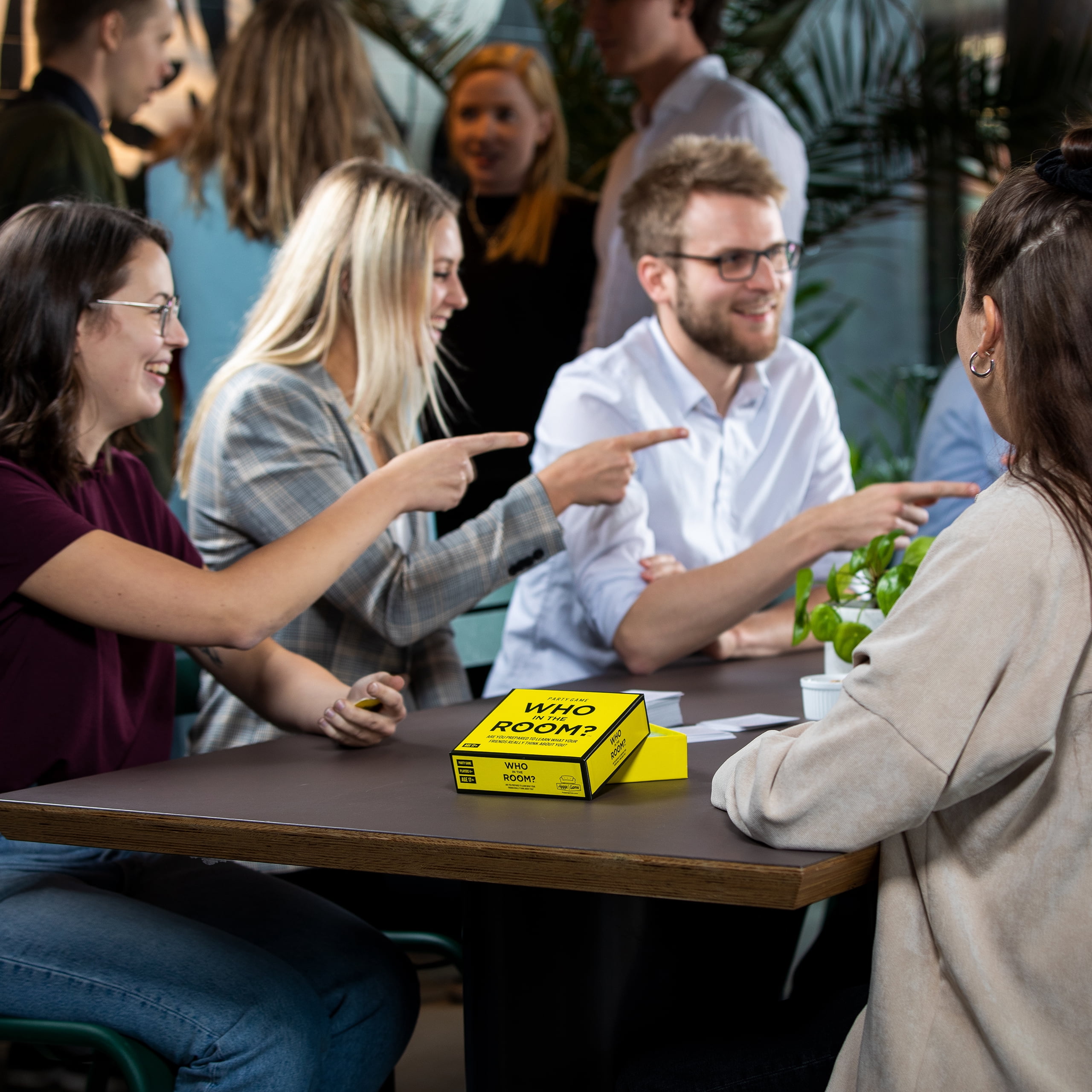Who in the Room? Point, Laugh, Repeat! Party Game for Ages 17 and up by Hygge Games