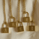 thumbnail image 1 of Collar de hip hop con múltiples capas de acero inoxidable y candado concéntrico cruzado, 1 of 5
