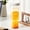 White, variant on 34 oz Plastic Water Bottle with Filter, Portable Cold Brew Coffee & Fruit Tea Cup with Hidden Handle for Home, Office & Travel