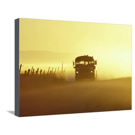 Rural School Bus Driving Along Dusty Country Road, Oregon, USA Stretched Canvas Print Wall Art By William