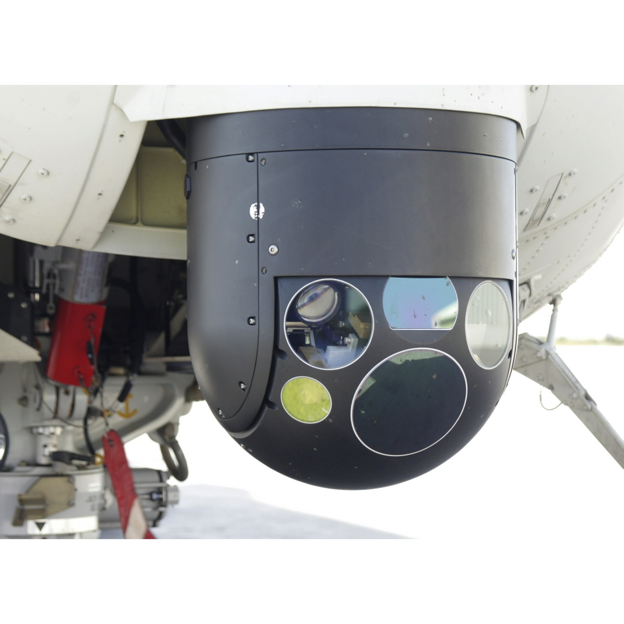 A Forward Looking Infrared camera, mounted on an EH101 utility