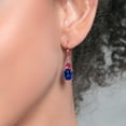 thumbnail image 3 of Gem Stone King 18K Rose Gold Plated Silver Blue Created Sapphire and Red Created Ruby Dangle Earrings for Women (7.46 Cttw, Gemstone September Birthstone, Oval 10X8MM, Trillion 5MM), 3 of 4