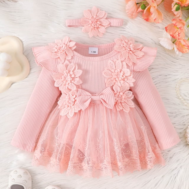 Infant Clothes Summer Bodysuit Rompers Dresses Baby Outfits Ropa De Bebe NiñA Baby Clothes For Girls 6-9 Months. A pink long-sleeve romper dress with floral lace detailing, ruffled shoulders, and a matching floral headband. The outfit features a bow at the chest and a tulle skirt with embroidered accents, designed for baby girls aged 6-9 months. Displayed on a soft white background with decorative flowers and baby accessories.