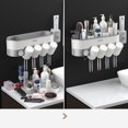 thumbnail image 4 of Juego de accesorios de baño, soporte magnético para cepillo de dientes con taza, dispensador de pasta de dientes, estante de almacenamiento de artículos de tocador, exprimidor de pasta de dientes, 4 of 4