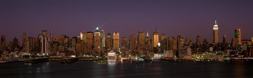 This is Midtown Manhattan and the East River at dusk It is the view from Hoboken New Jersey The Empire State Building is on the right hand side the Chrysler Building just right of center Canvas Art -