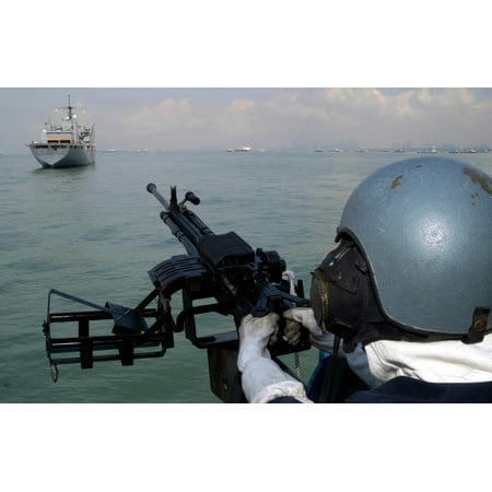 Military Sealift Command Ships - A gunner keeps his sight on the Military Sealift Command combat stores ship USNS Concord Poster Print by Stocktrek Images