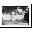 thumbnail image 2 of Historic Framed Print, Mrs. J.W. Gerard, standing in front of counter at Hope Farm Fair, 17-7/8" x 21-7/8", 2 of 9