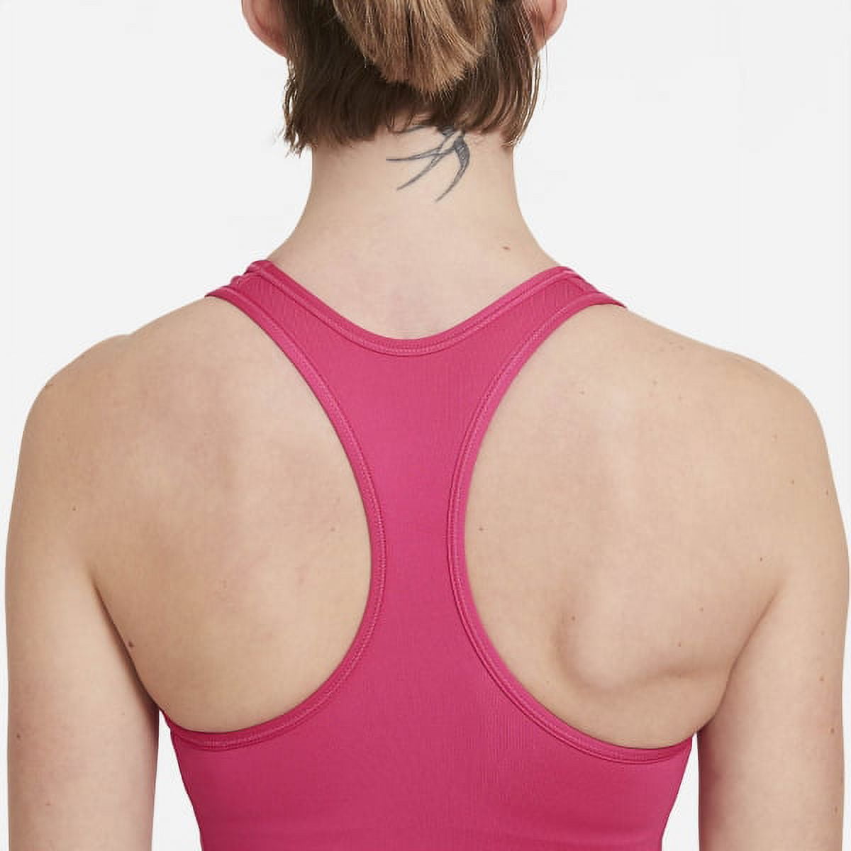 Nike Training Swoosh Futura graphic medium support sports bra in pink -  ShopStyle
