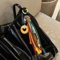 thumbnail image 2 of Bolso escolar con forma de salchicha coreana, colgante divertido para pareja, llavero con cadena y cuerda de color contrastante., 2 of 7