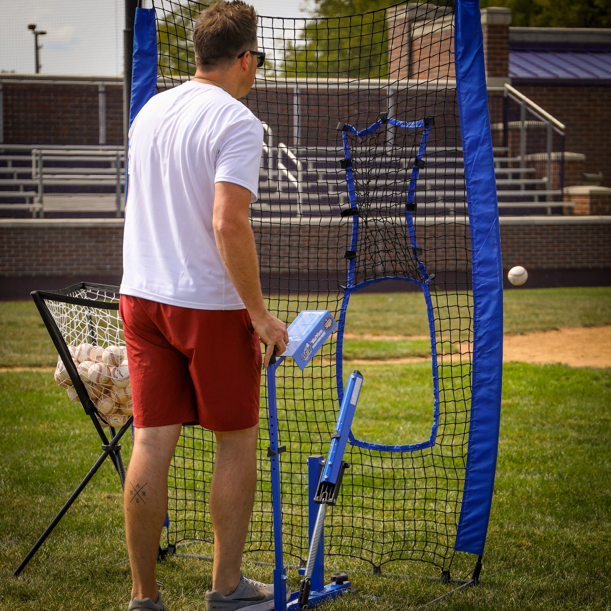 Louisville Slugger Blue Flame Pitching Machine – Manual Baseball & Softball Trainer, Throws Up to 60 MPH, Youth & Adult Practice Tool