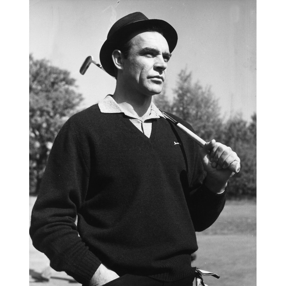 Film still of Sean Connery holding a golf club in Goldfinger Photo