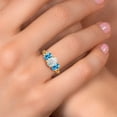 thumbnail image 4 of Gem Stone King 18K Yellow Gold Plated Silver White Opal and Swiss Blue Topaz Filigree Style 3 Stone Ring for Women (2.10 Cttw, Oval 8X6MM and 6X4MM) (Size 6), 4 of 6