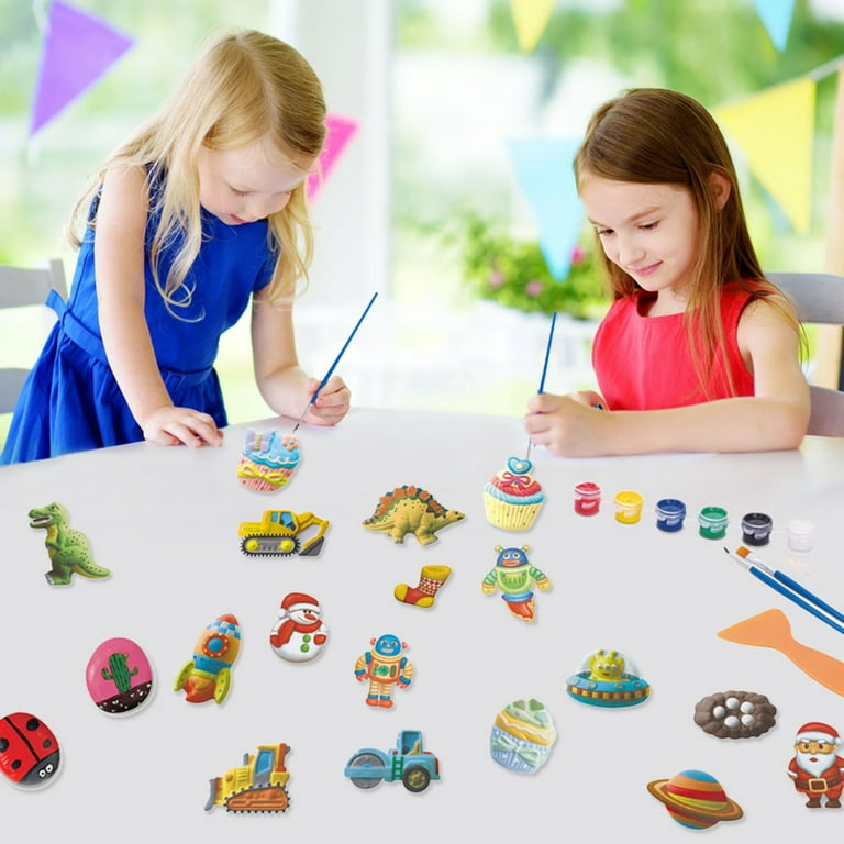 Toddler painting with toys