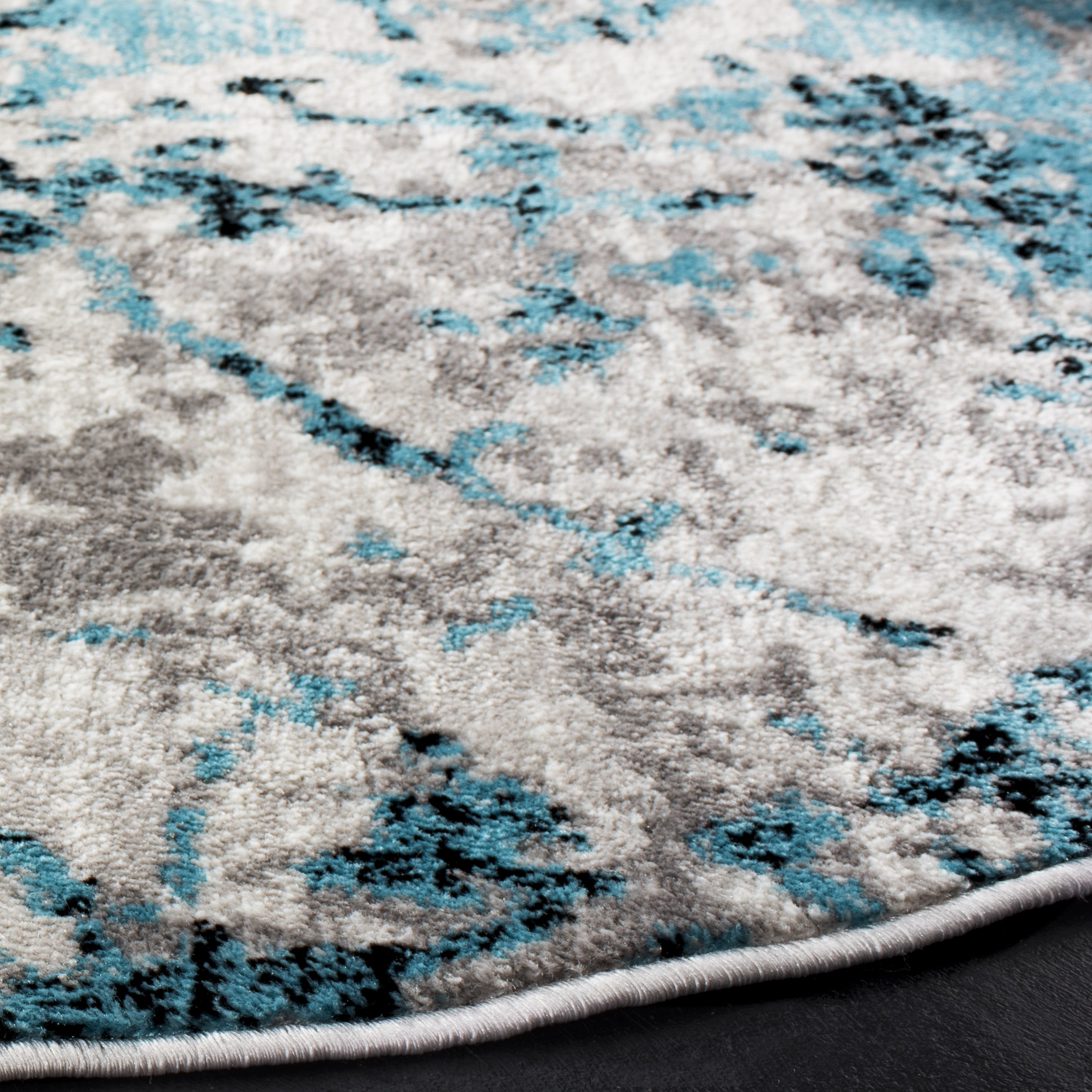 SAFAVIEH Skyler Joisse Abstract Area Rug, Blue/Ivory, 6'7" x 6'7" Round