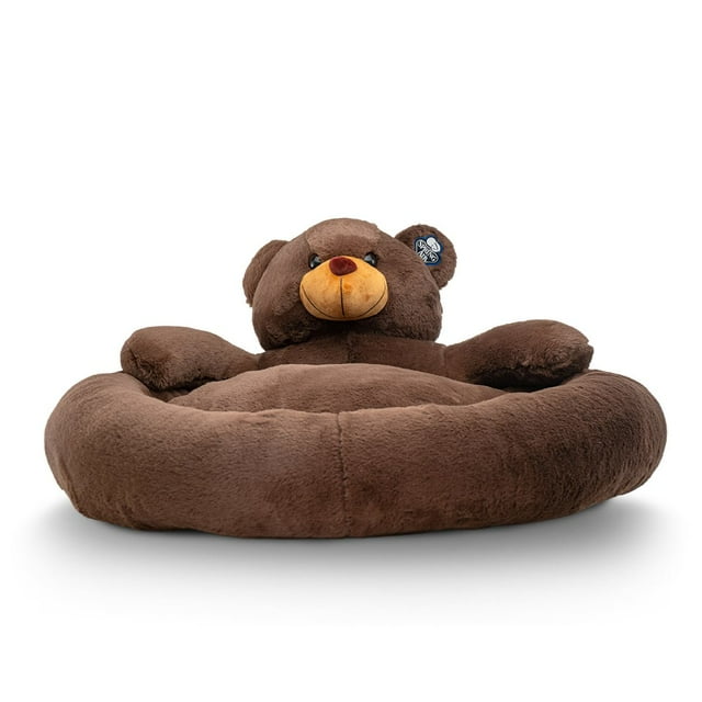 cama para perro spring air confortable con base impermeable cama redonda color café con respaldo en forma de oso, vista frontal a nivel; superficie acolchonada y rellena, bordes elevados que alivian puntos de presión, etiqueta Spring Air visible en la oreja y base 100% impermeable indicada; tamaño ideal para perros medianos a grandes (18 x 90 x 75 cm). Suele usarse también como área de descanso portátil para viajes o zonas de juego.