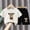 White, variant on Amidoa Girls 2 Piece Outfits Summer Clothes Cotton Short Sleeve T-Shirt and Shorts Casual Kids Clothing Sets,Black Size 2T