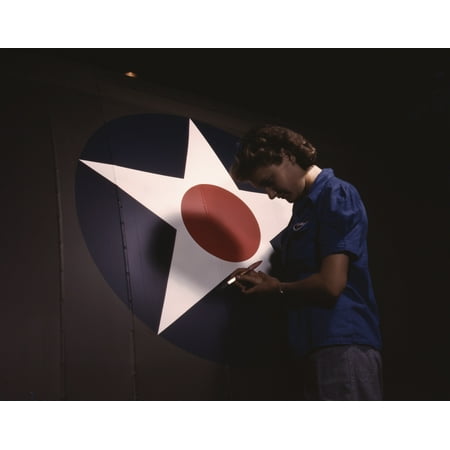 Us Army Air Force - A woman touching up the US Army Air Forces insignia on side of a dive bomber plane 1943 Poster Print by Stocktrek Images