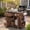 Brown, variant on Harper & Bright Designs Outdoor Kitchen Island with Extendable Stainless Steel Top, Foldable Outdoor Grill Prep Station Table with Side Spice Rack, Kitchen Cart with Drawers and Storage, Gray