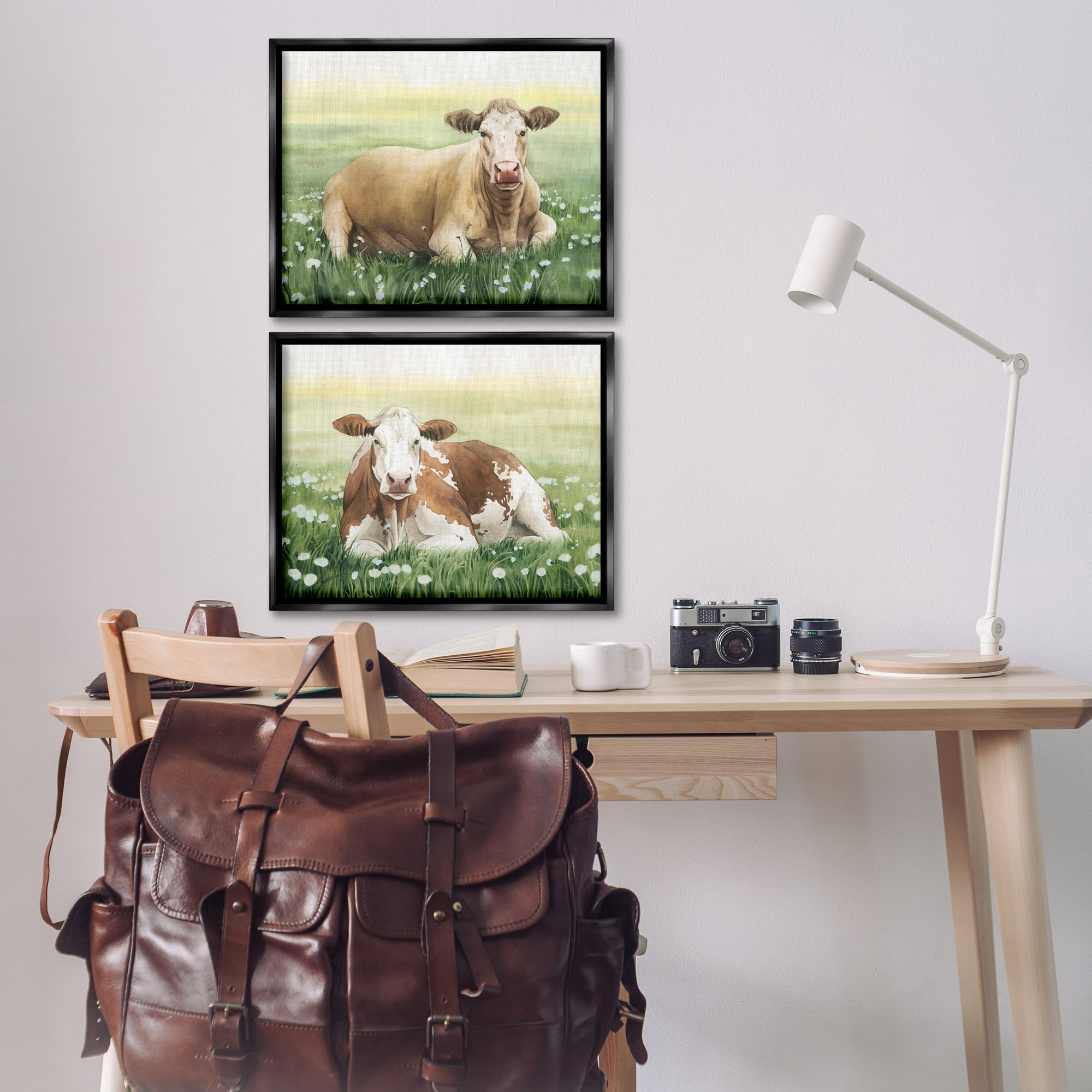 Stupell Industries Cows Resting in Flower Field Animals Painting Black Floater Framed Canvas Art Print Wall Art, 21 x 17, Set of 2